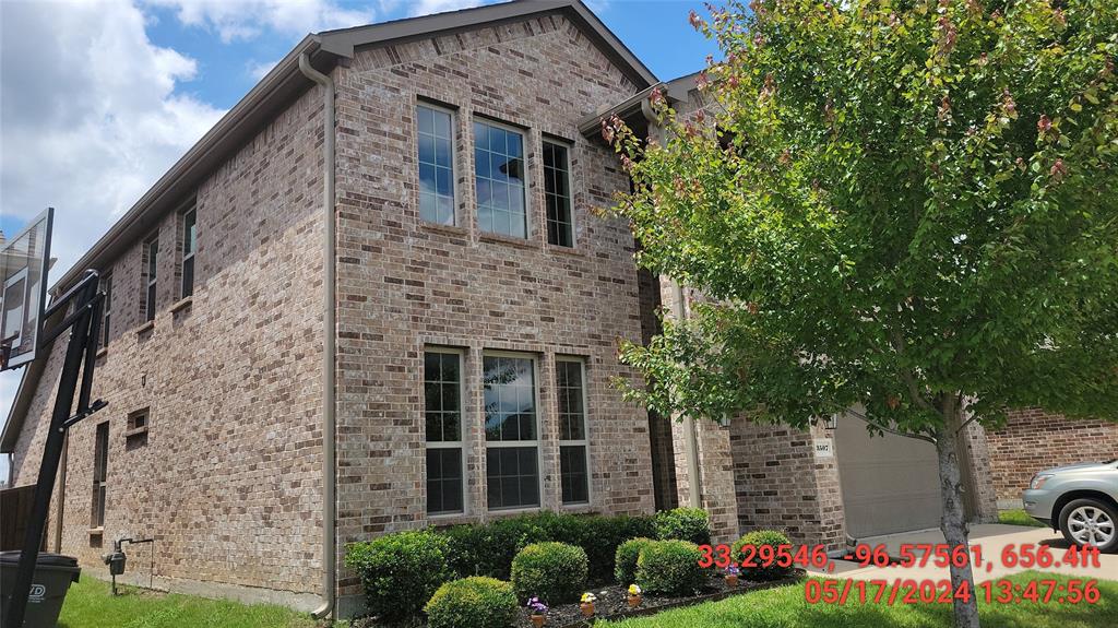 a brick building with a yard