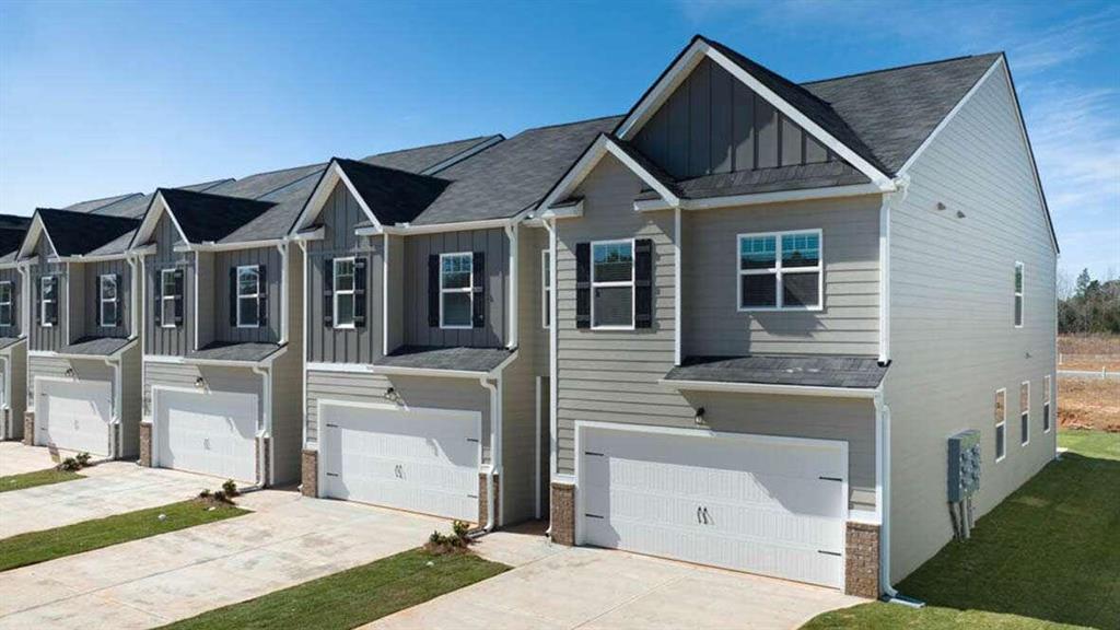 a front view of a house with yard