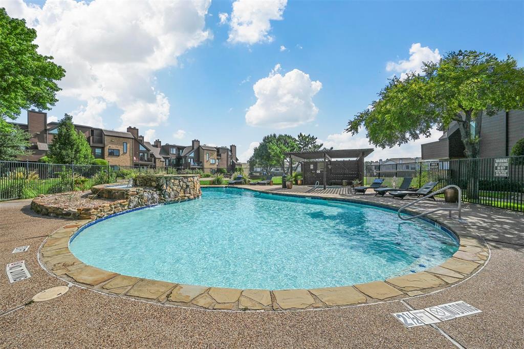 a view of a swimming pool with a patio