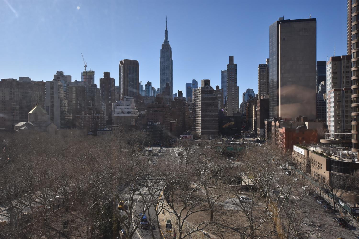 a view of a city with tall buildings