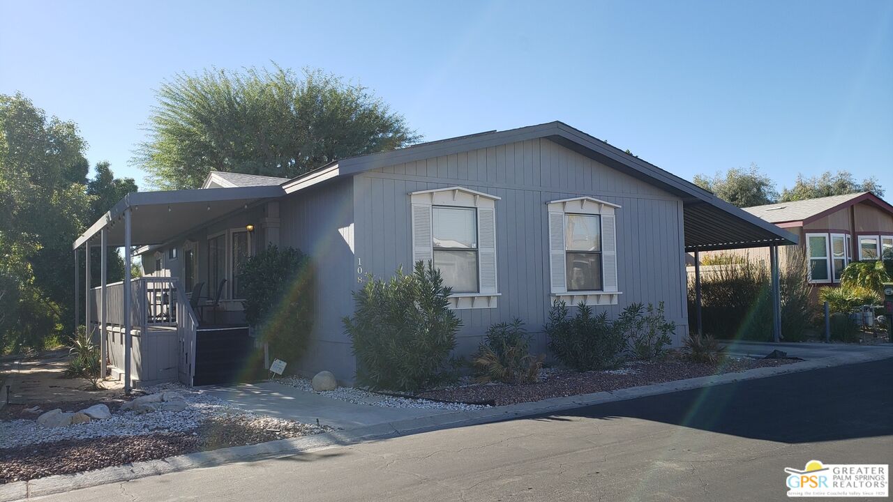 a front view of a house with yard