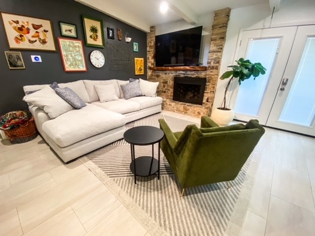 a living room with furniture and a flat screen tv