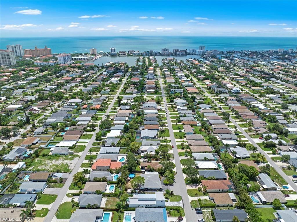 an aerial view of residential houses with city view