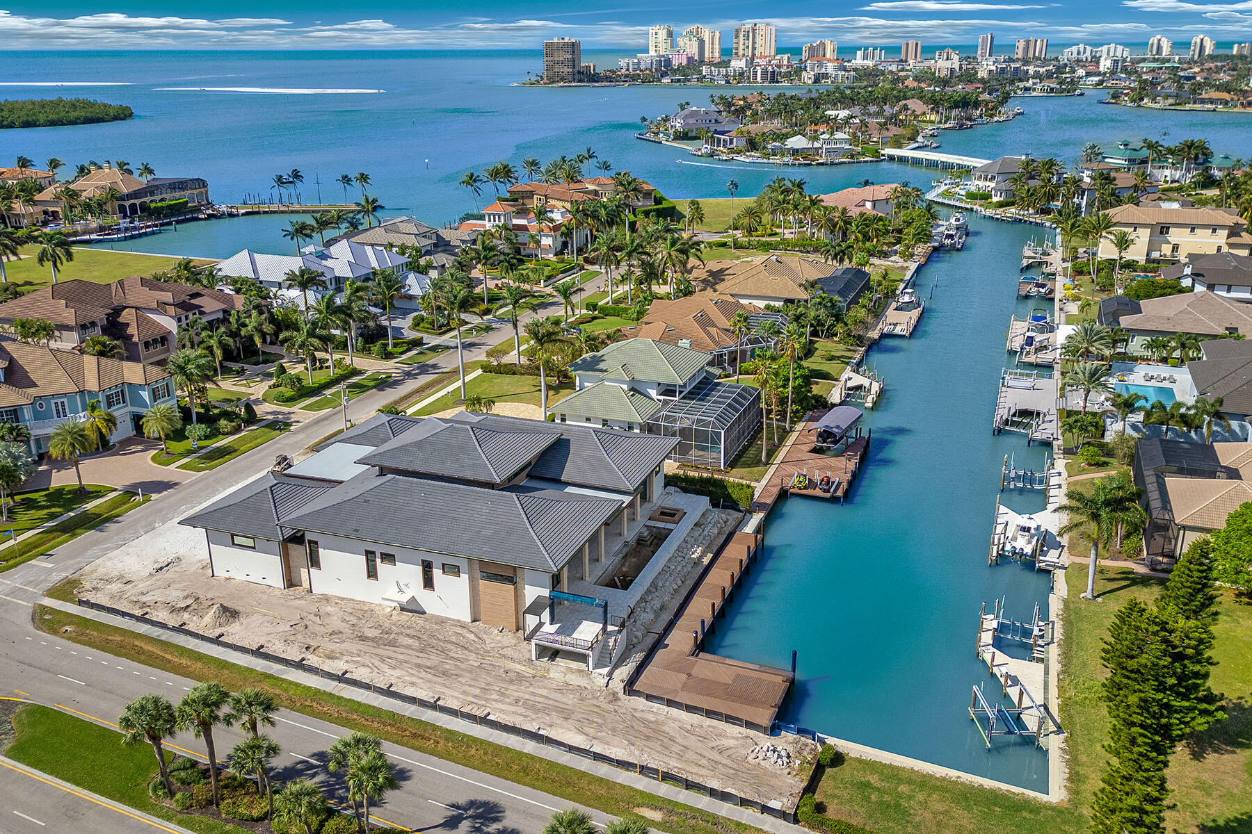 an aerial view of a house with a ocean view