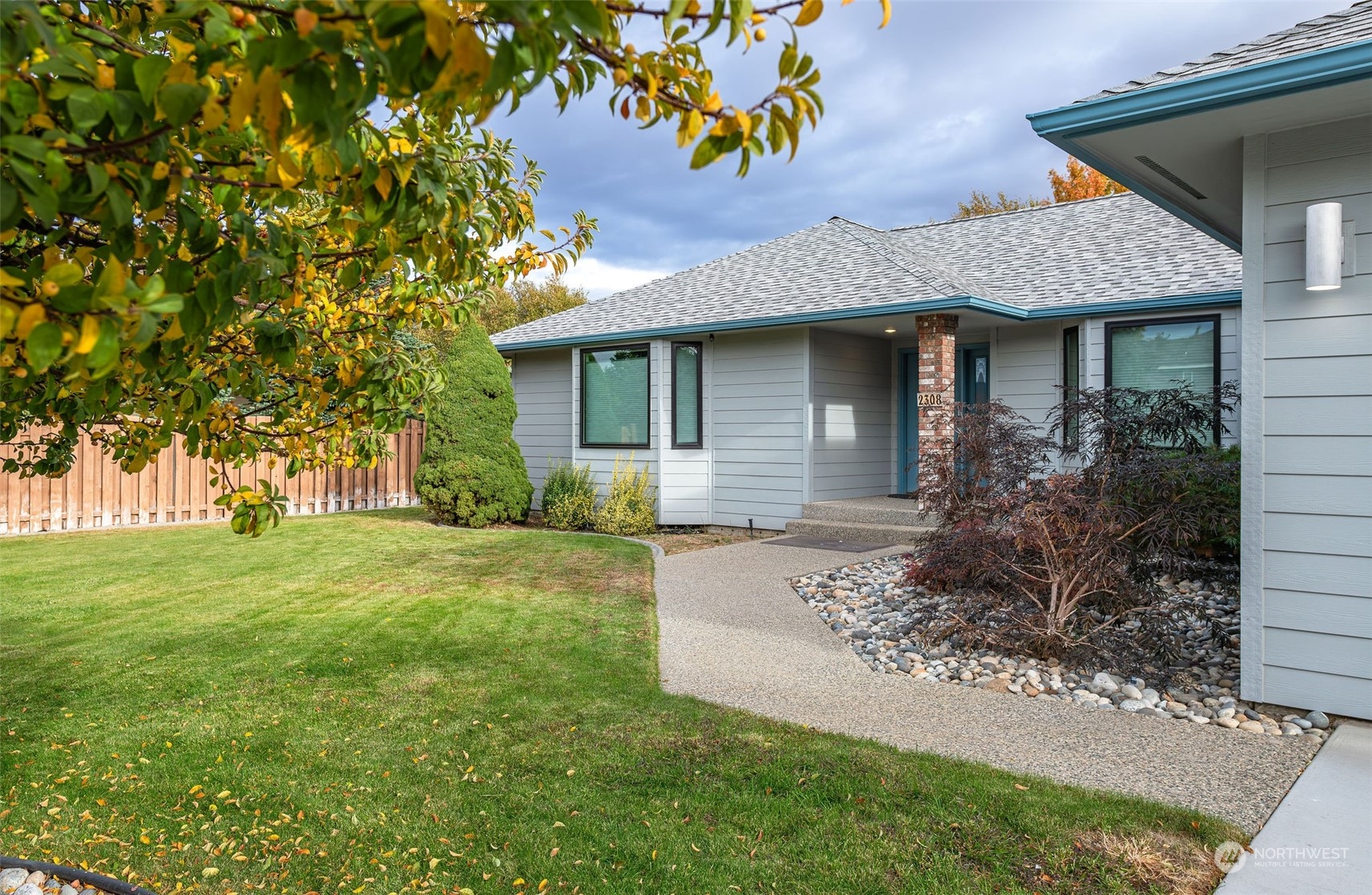 front view of a house with a yard