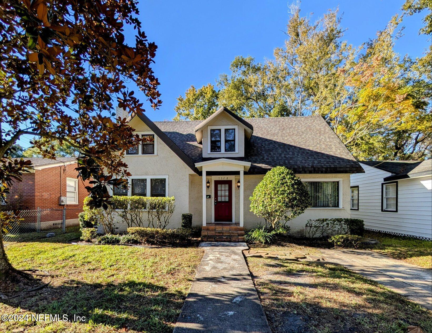 front view of a house with a yard