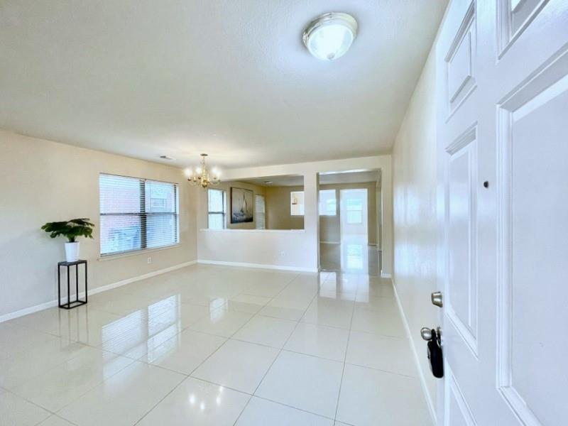 a view of livingroom with furniture and window