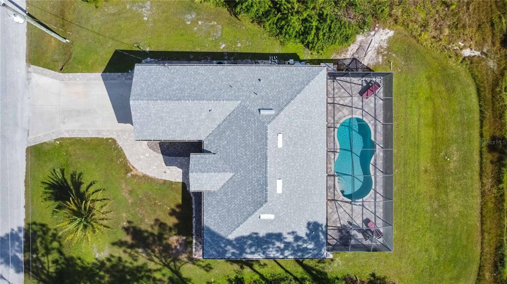 a aerial view of a house with a swimming pool