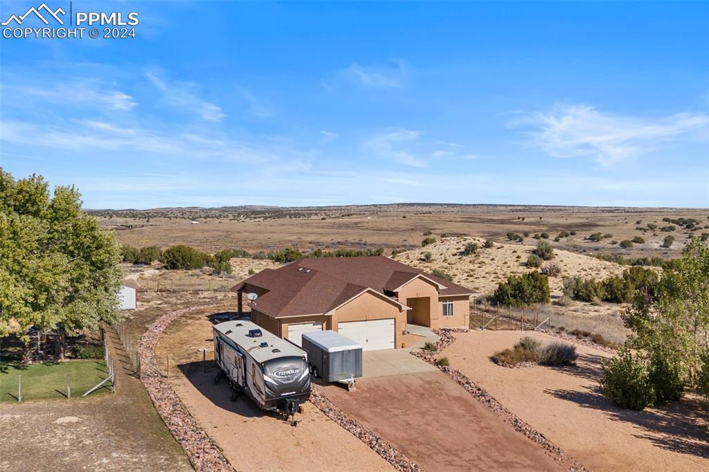 an aerial view of a house with a garden