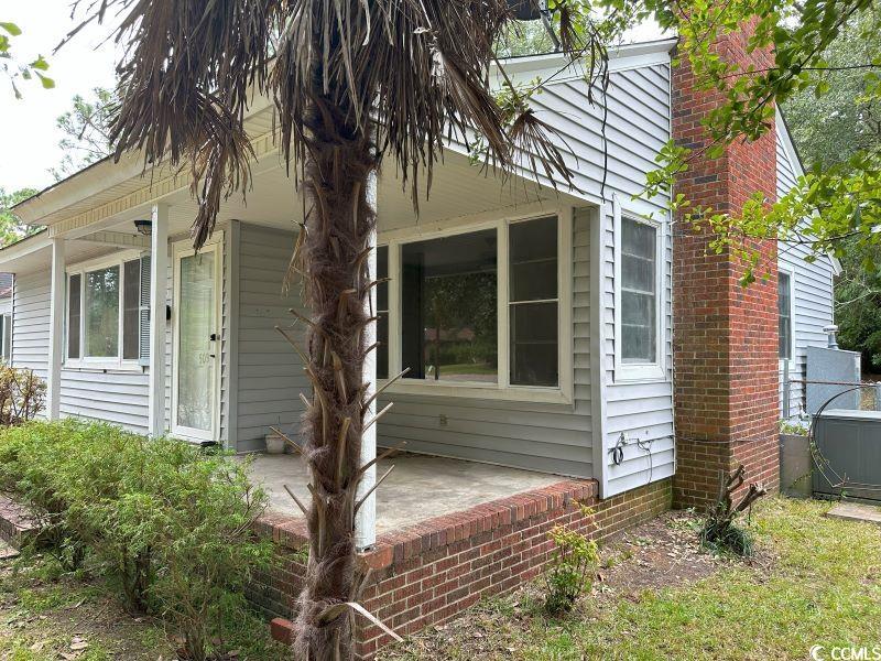 View of property exterior featuring a patio