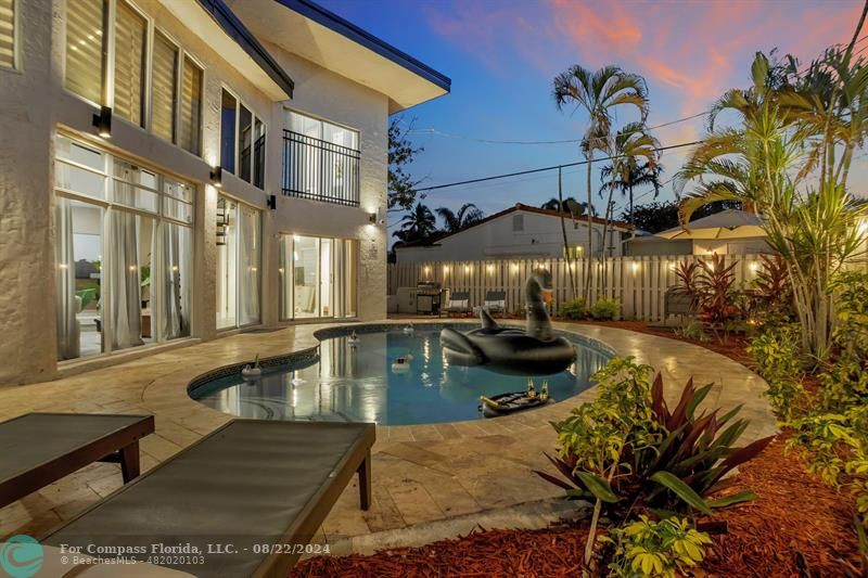 a view of a swimming pool with a patio