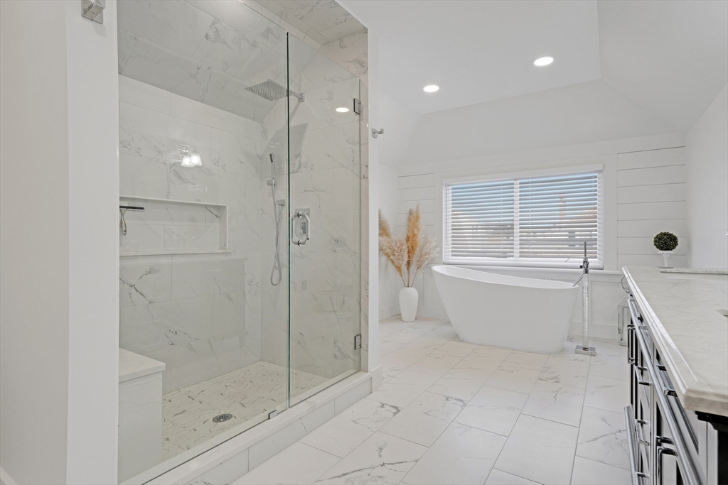 a bathroom with a bathtub and shower