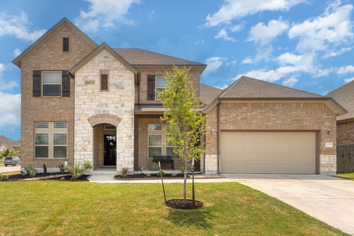 a front view of a house with a yard