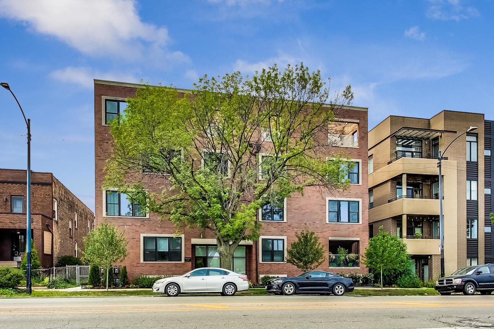 a car parked in front of a brick building