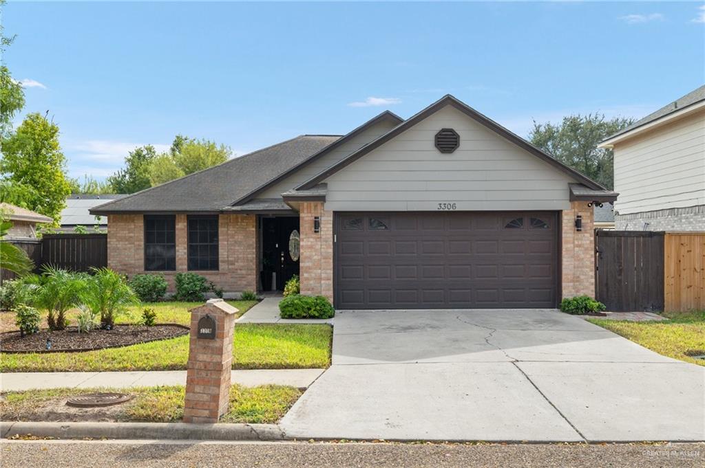 a front view of house with garage and yard