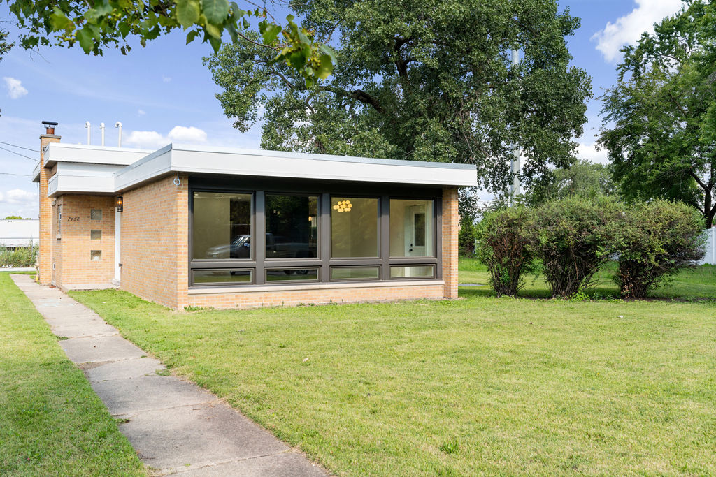 a view of a house with a garden