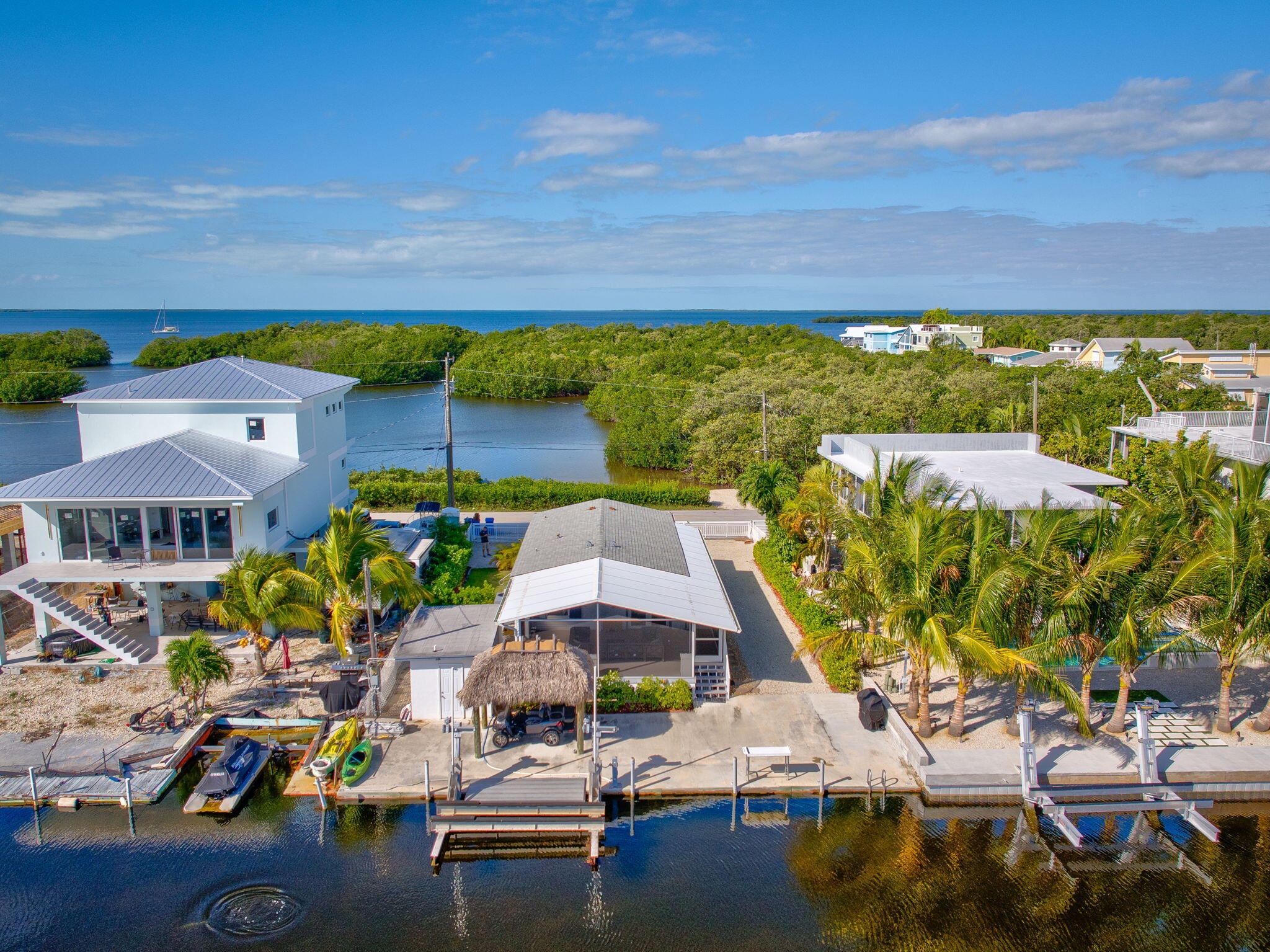 an aerial view of a house with a ocean view