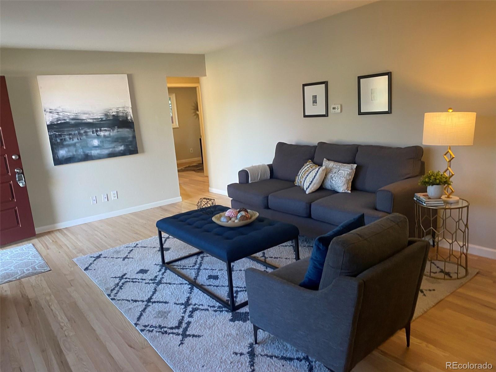 a living room with furniture and a table