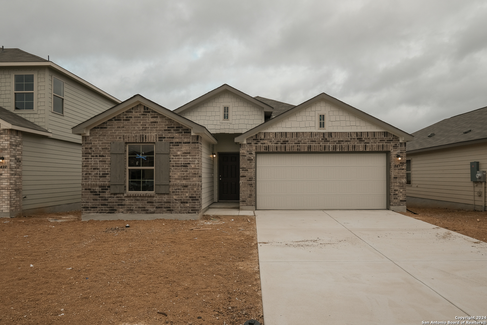 front view of a house with yard