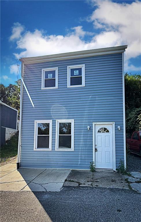 a front view of a house with garage