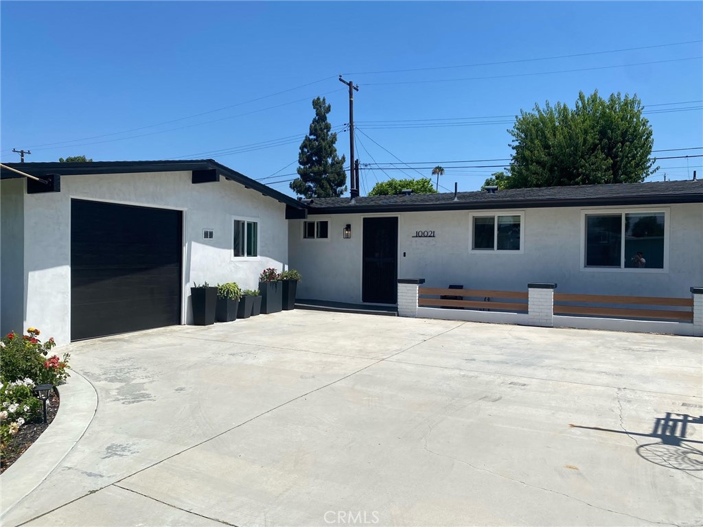 a front view of a house with a outdoor space