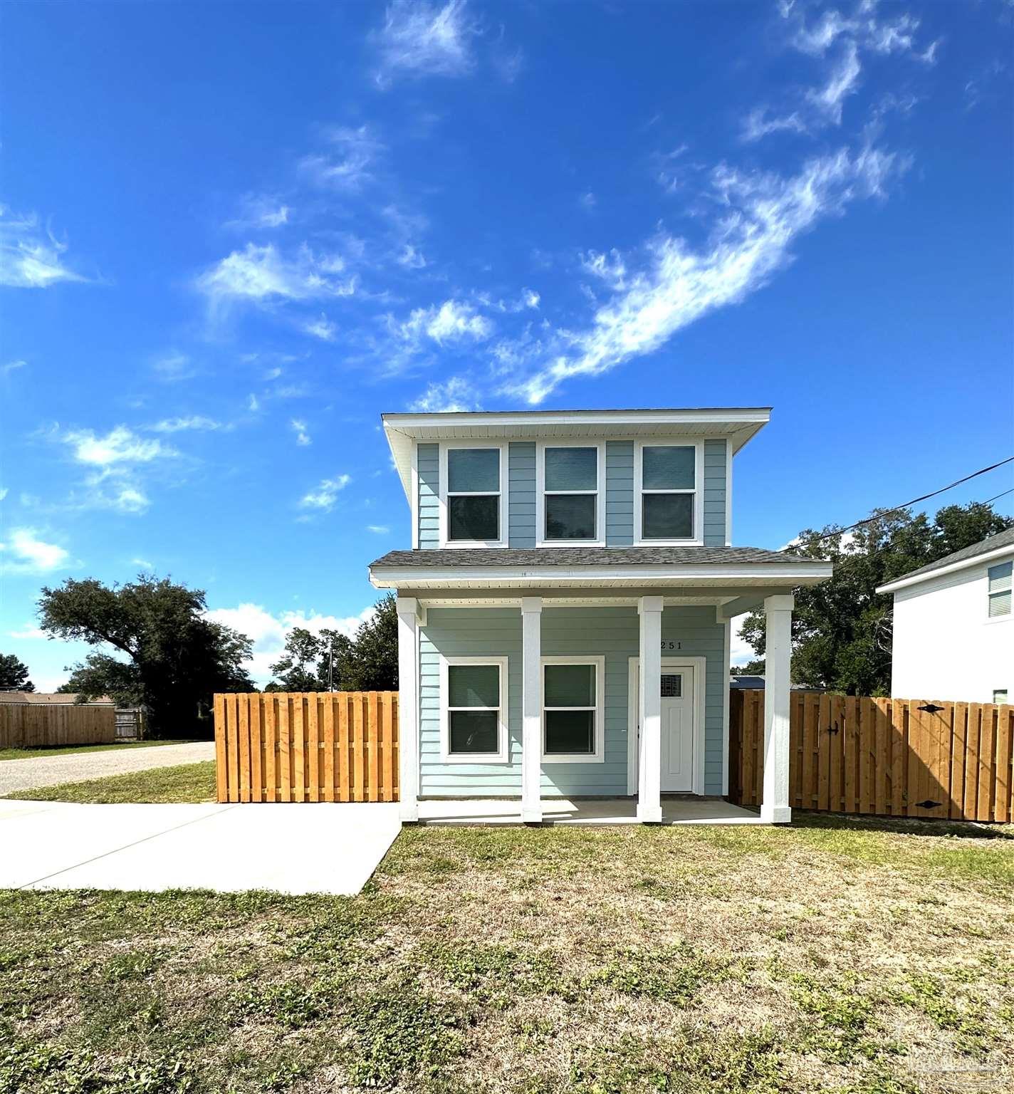 front view of a house with a yard