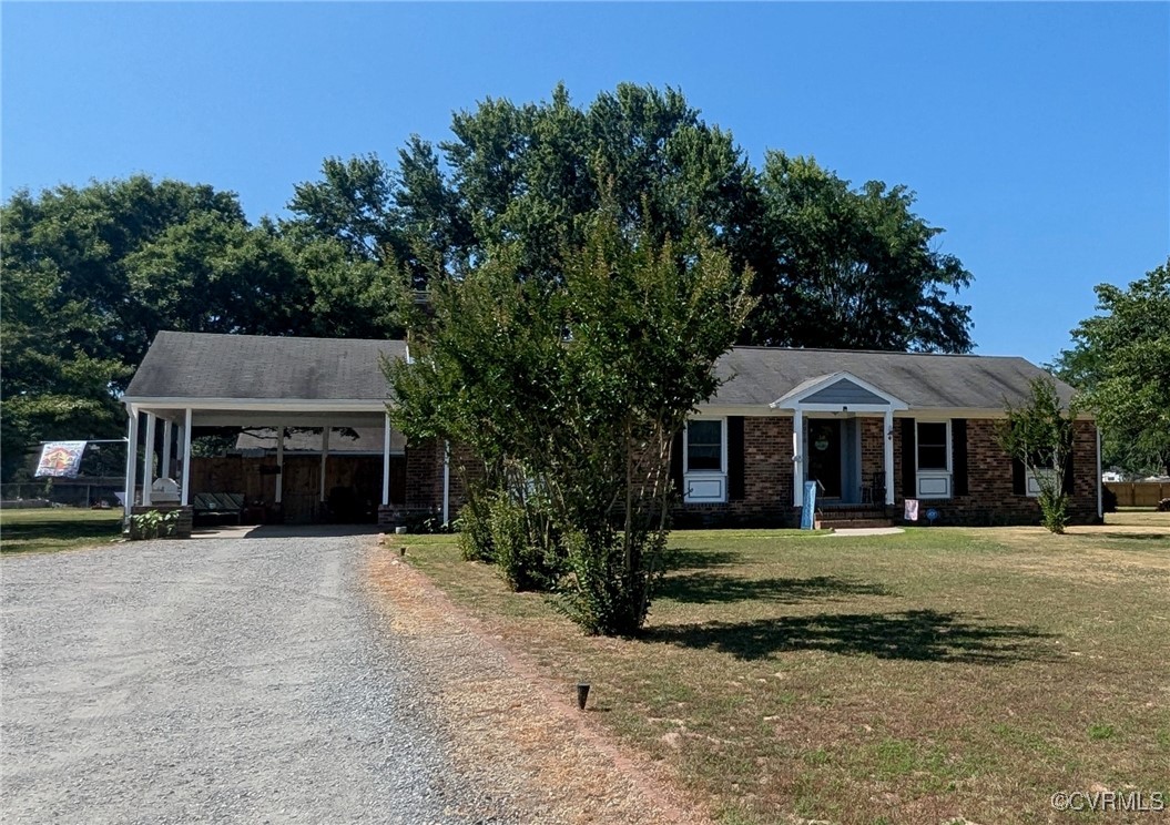 View of front of property featuring a front yard a