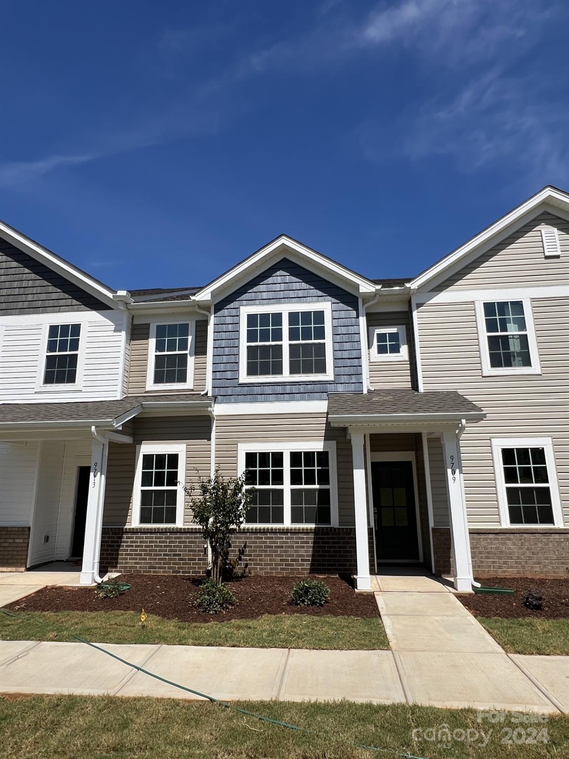 a front view of a house with yard