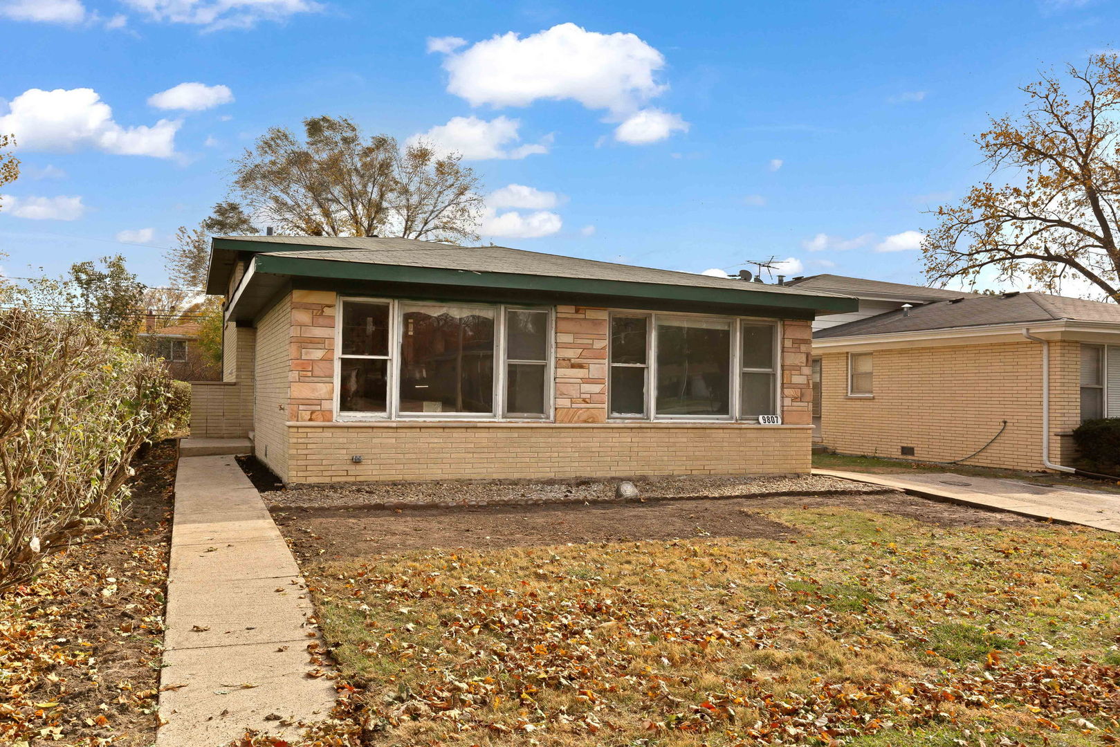 a view of house with backyard space