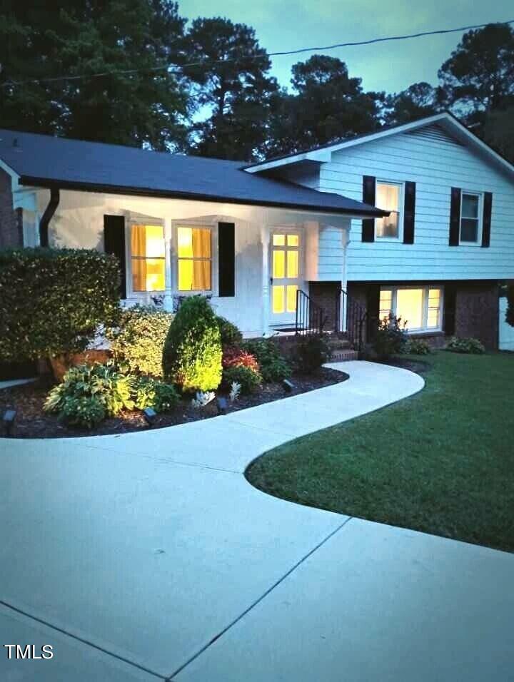 a front view of a house with a yard