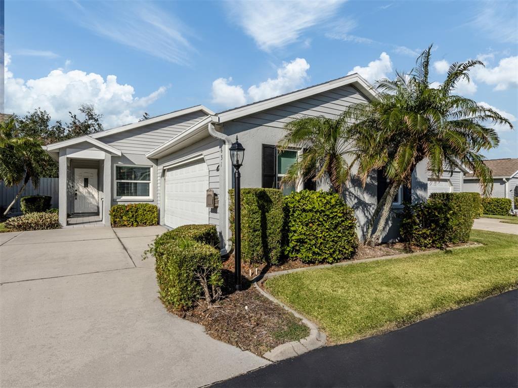 Front of home with side garage entry with plenty of room for guest parking out front.