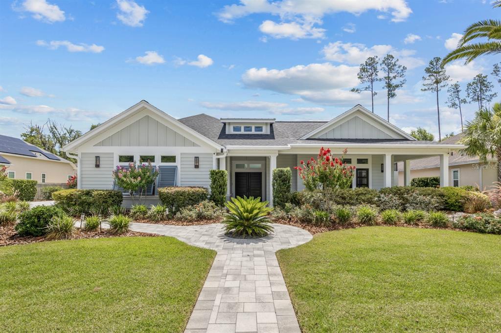 a front view of house with yard and green space