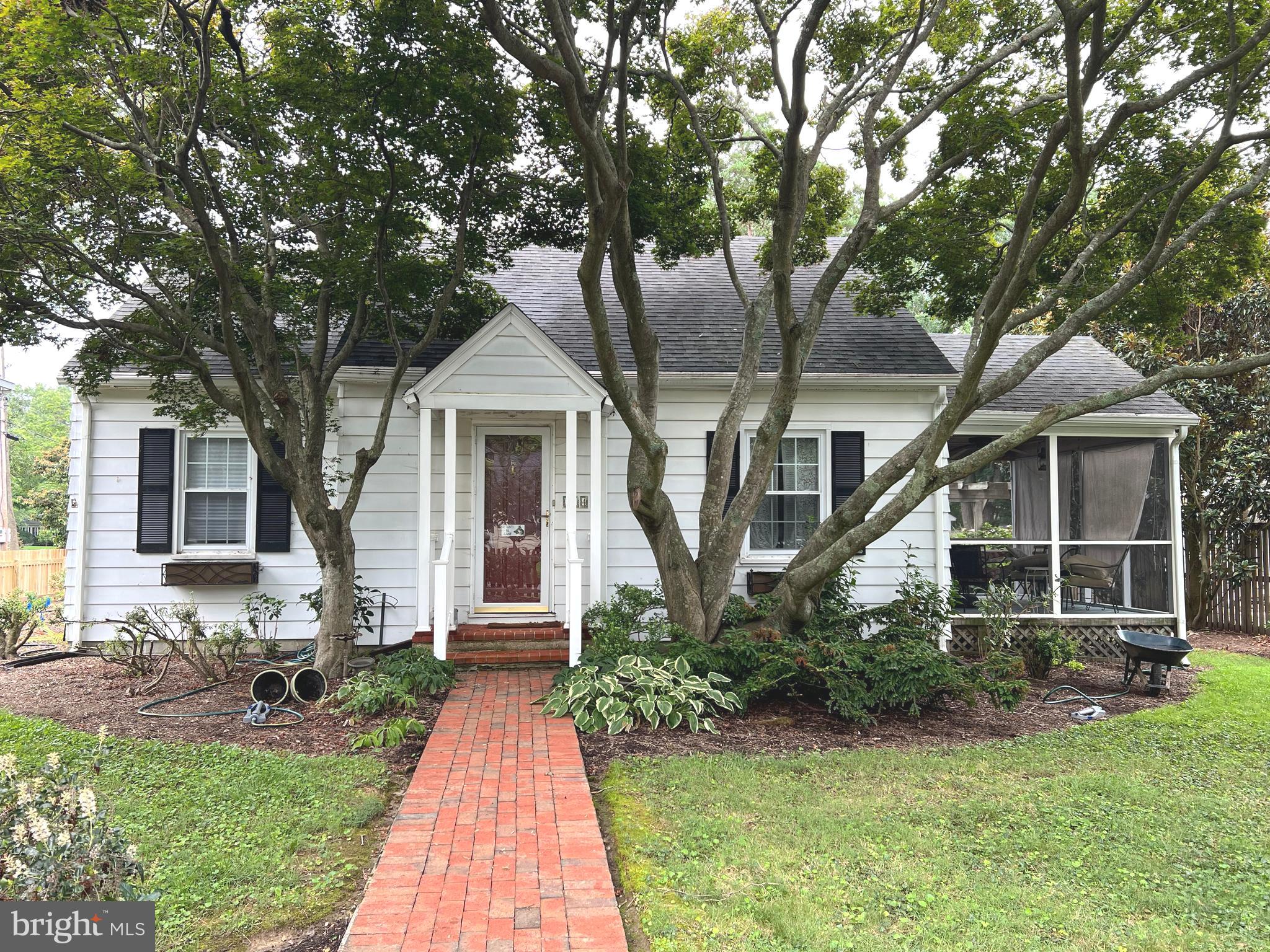 front view of a house with a yard