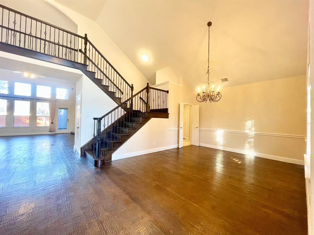 a view of an empty room with stairs