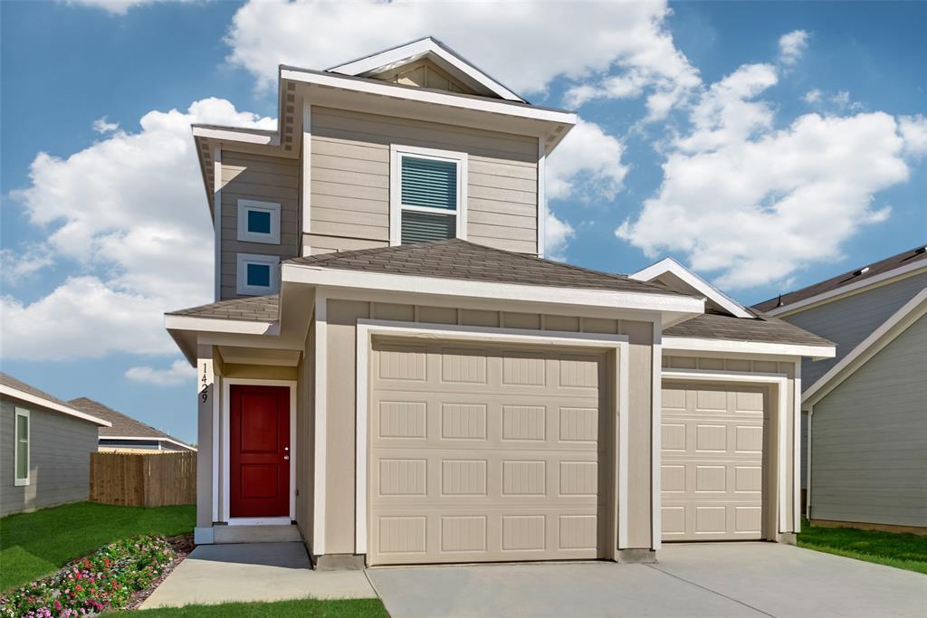 a front view of a house with garage