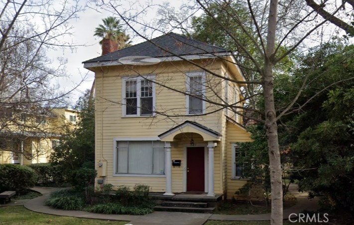 a front view of a house with yard