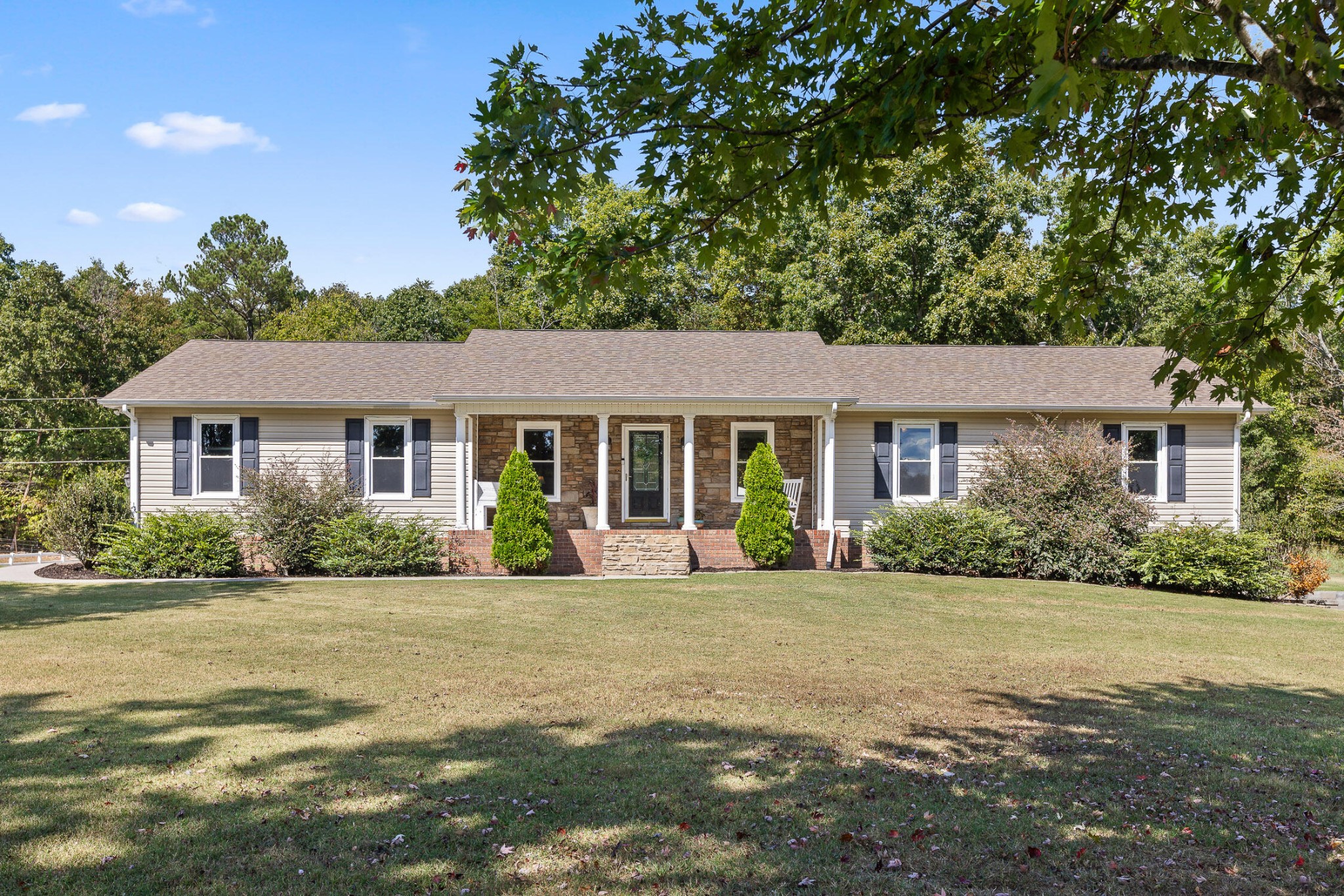 a front view of a house with a yard