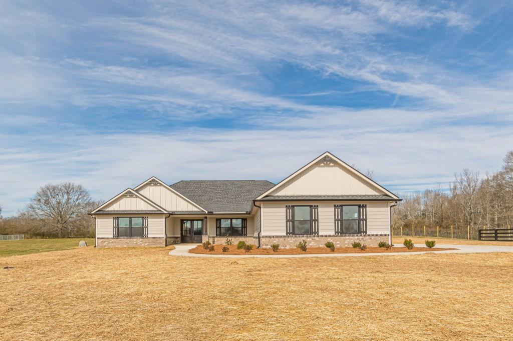 a front view of house with yard and green space