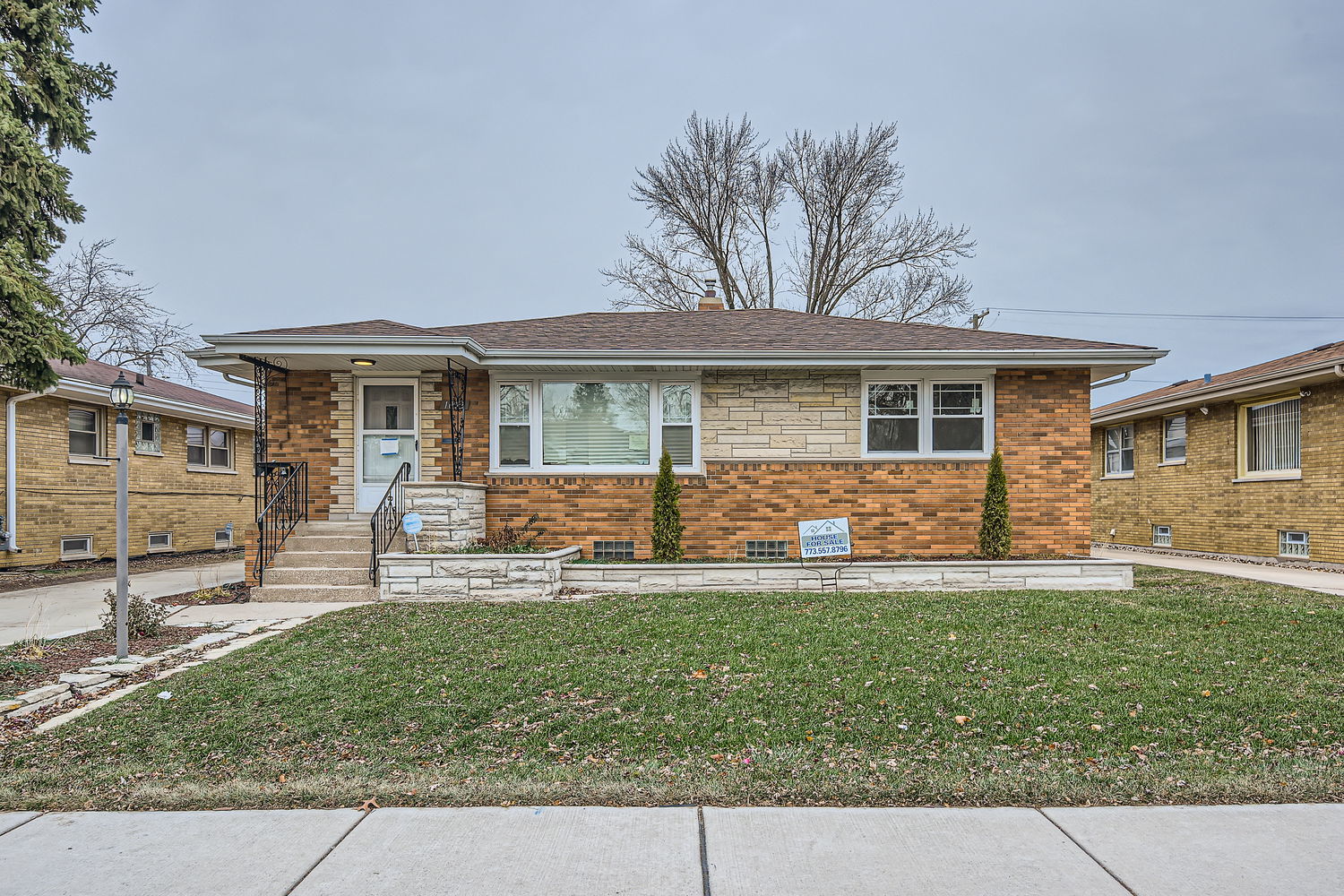 front view of a house with a yard