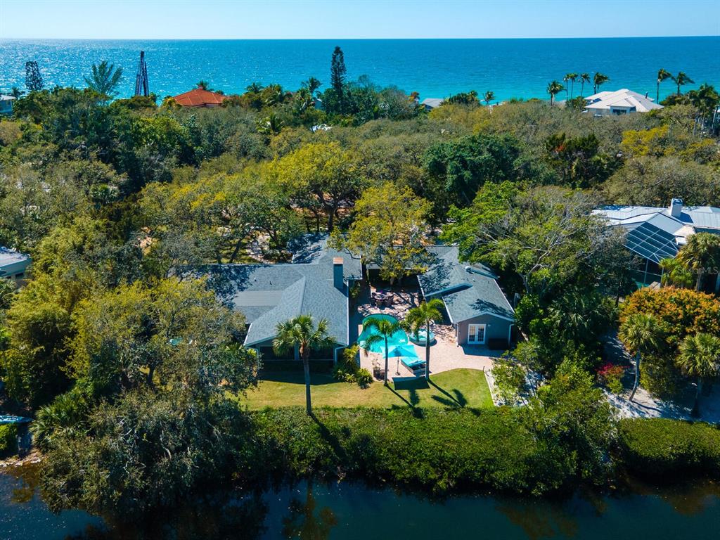 an aerial view of a house with a yard