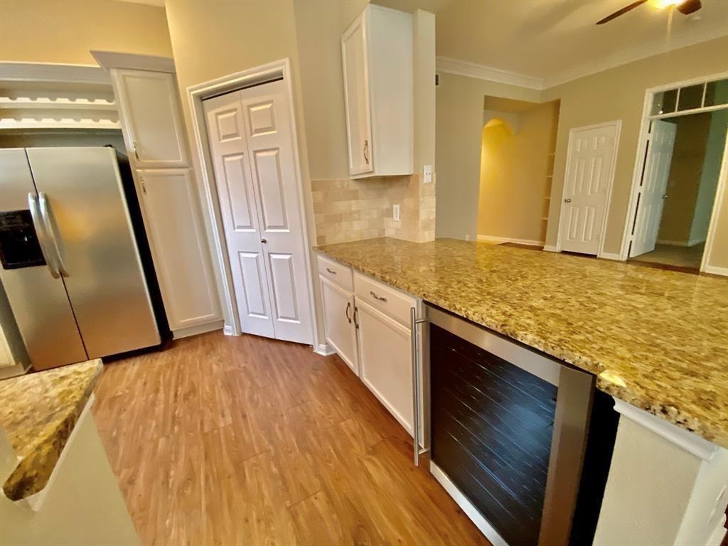 a view of a kitchen from the hallway