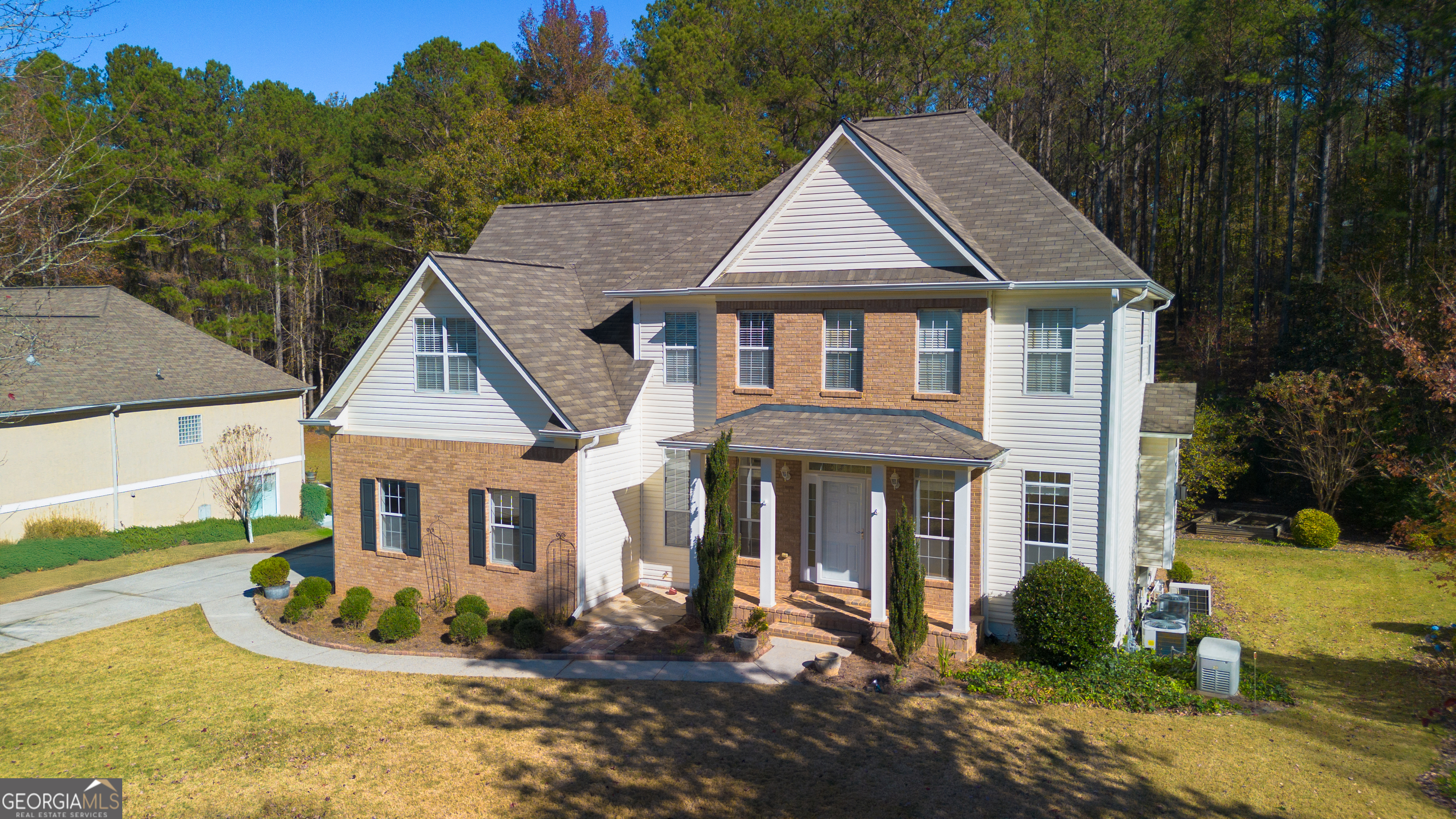 a front view of a house with a yard