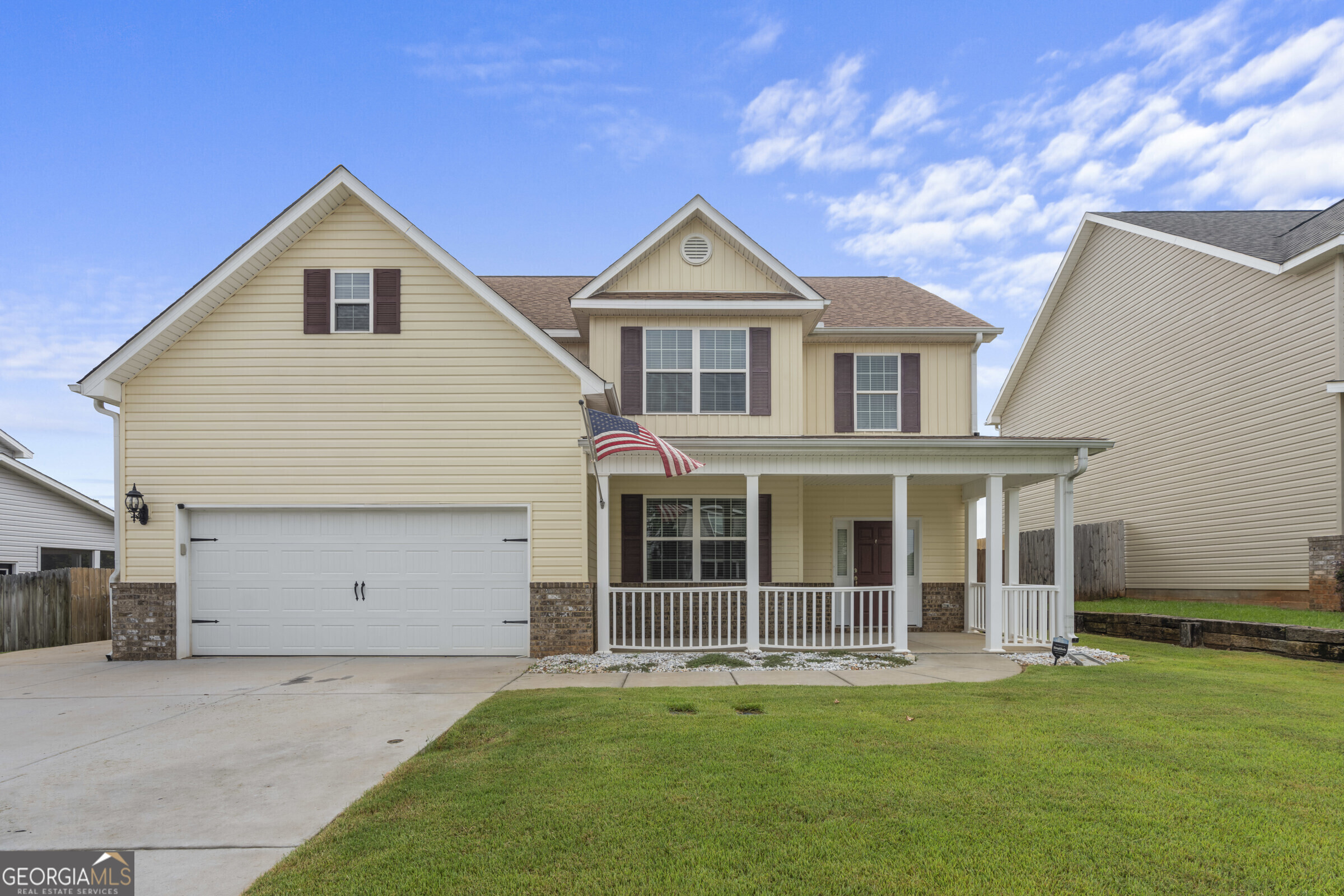 a front view of a house with a yard