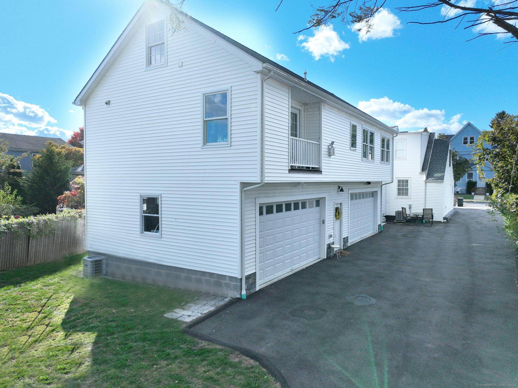 a view of a house with a yard and a garage