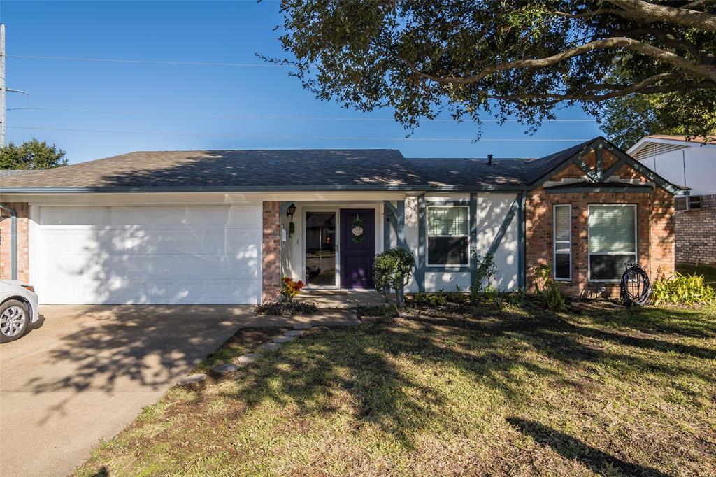 a front view of a house with a big yard