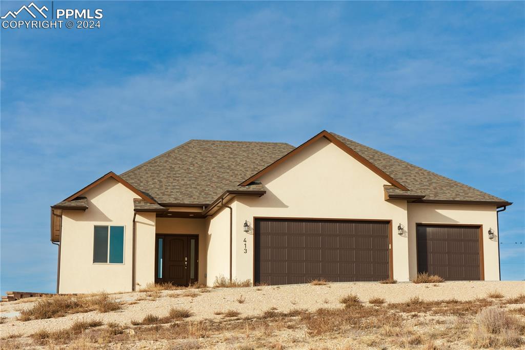 View of front of house with a garage