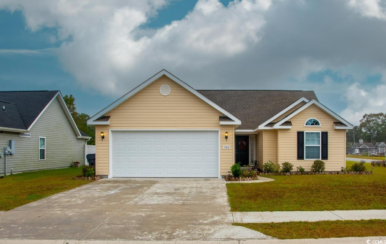 View of front of house featuring a front yard and