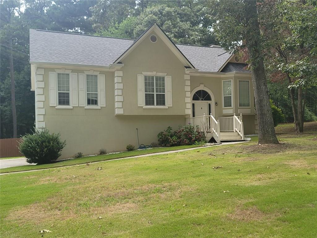 a front view of a house with a yard