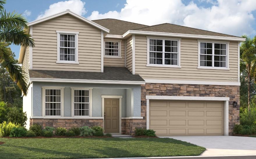 a front view of a house with a yard and garage