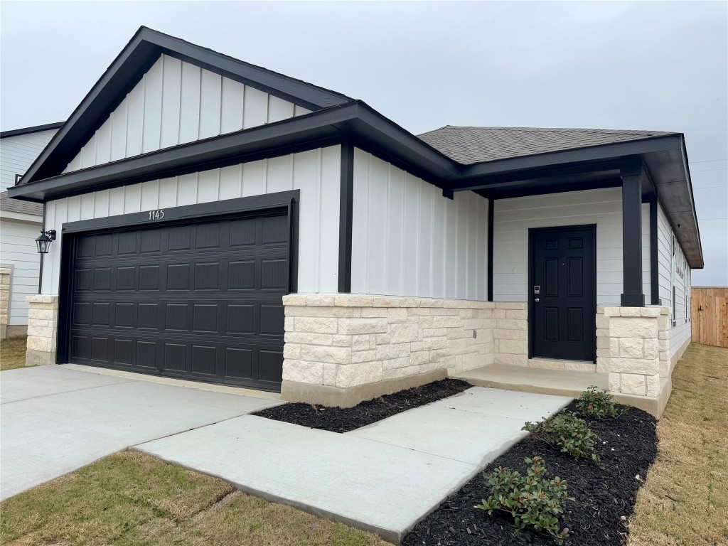 a front view of a house with a garage